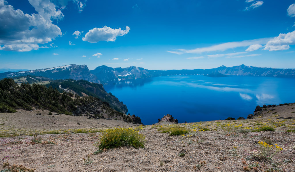 View of crater lake with clear blue water.