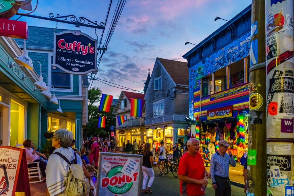 Crowd of people walking down a street in Provincetown, MA