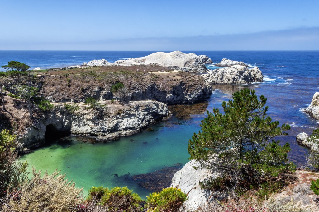 A rocky turquoise ocean cove 
