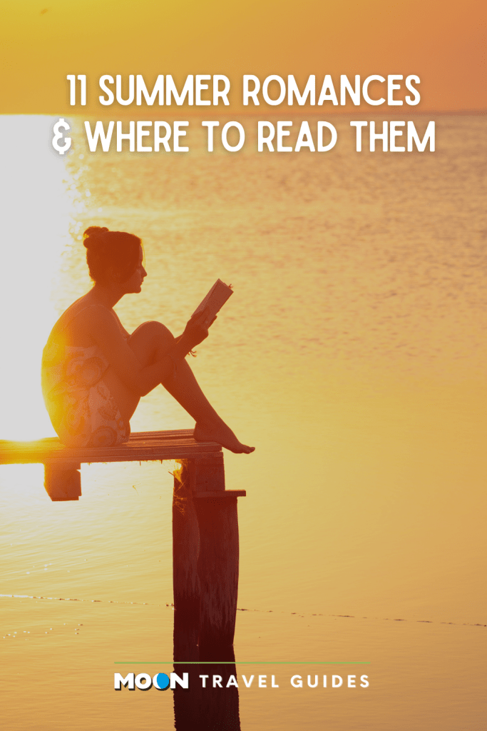 woman reading on doc over water under a golden sunset
