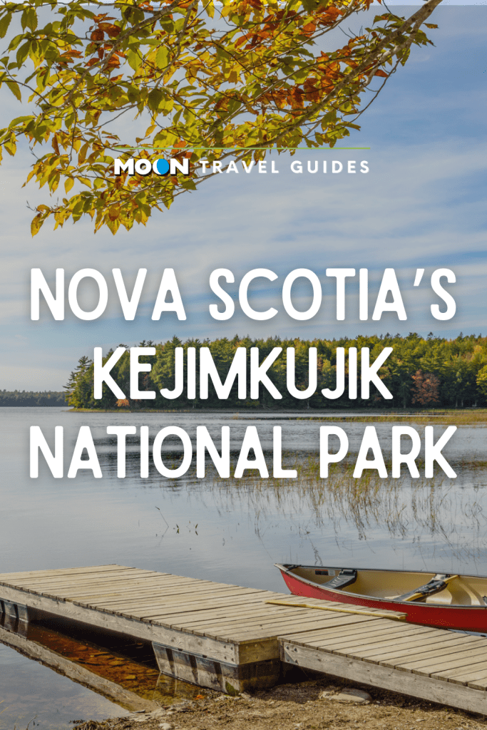 Image of boat dock on a lake with text Nova Scotia's Kejimkujik National Park
