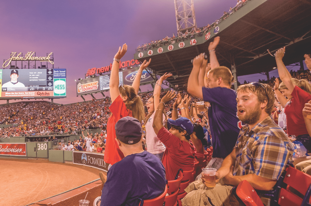 Photo of fans cheering at Fenway Park