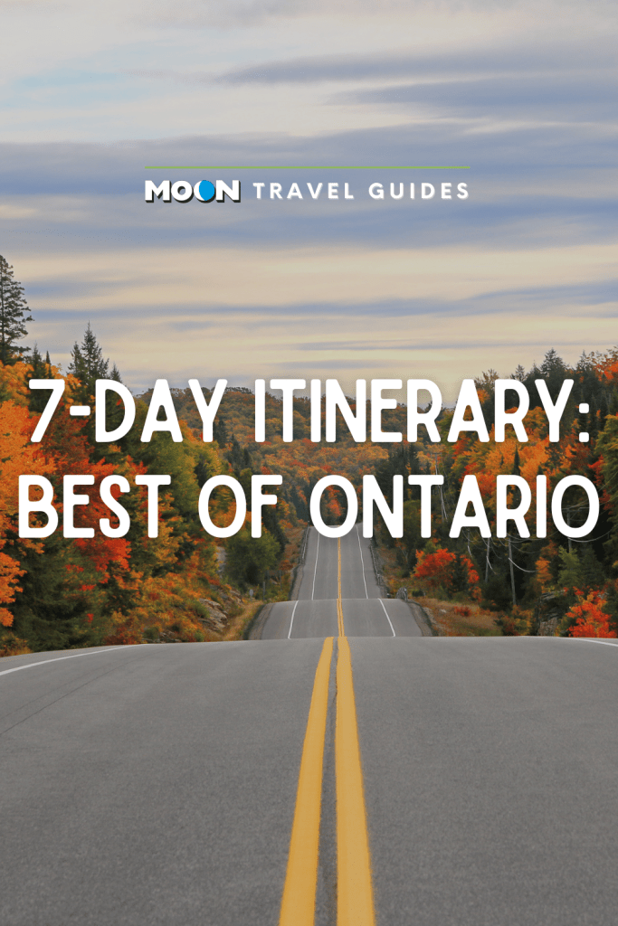 Image of road leading between colorful fall forest with text 7-Day Itinerary: Best of Ontario.